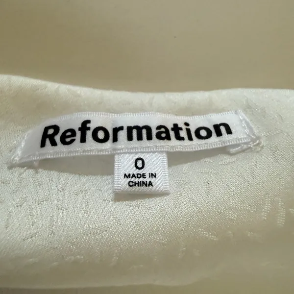 REFORMATION | White Jacquard Satin Allira Asymmetrical Off Shoulder Blouse | 0 - Image 8