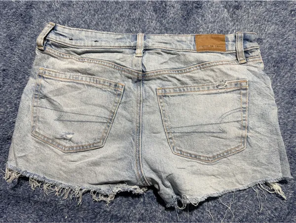 American Eagle Light Wash Distressed Denim Shorts with Frayed Hem - Image 4