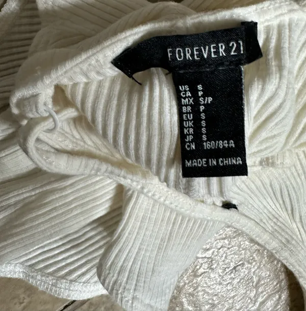 Forever 21 white ribbed bodysuit with a plunging V-neckline is a size small. - Image 3