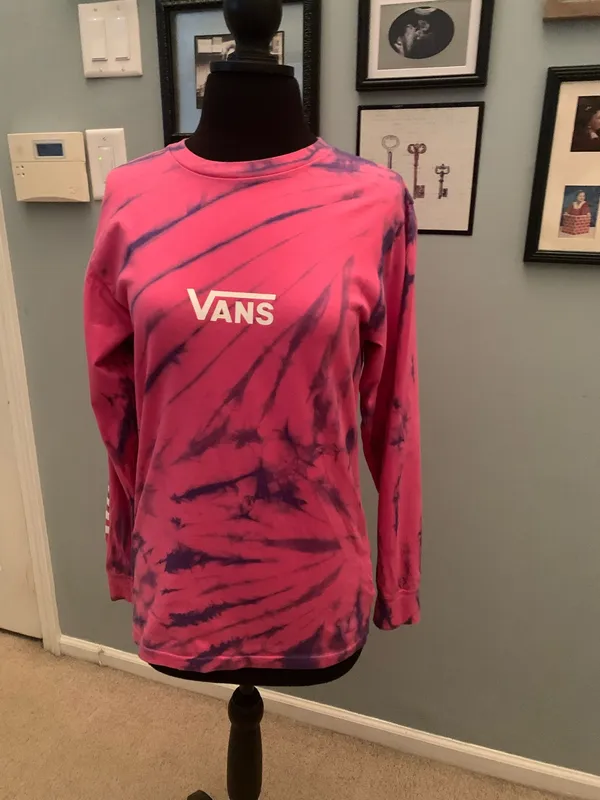 This is a pink and purple Vans tie-dye long-sleeve t-shirt featuring the brand's signature white logo on the chest. - Image 2