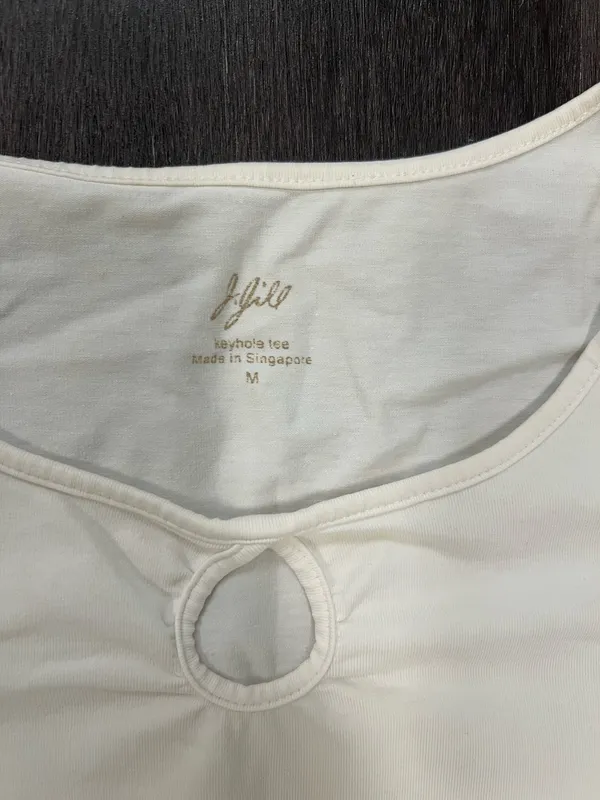 Soft cream long sleeve top with a modest scoop neckline. Features a small decorative ring keyhole at center front. Lightweight, easy to layer for casual or office wear. Simple, clean silhouette for versatile styling. J, Jill size medium. 95% cotton 5% spandex - Image 3