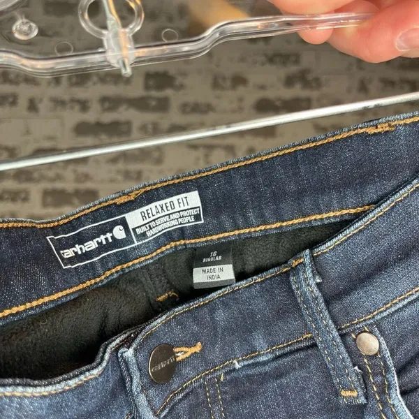 Carhartt | women fleeced lined denim jeans relaxed fit - Image 3