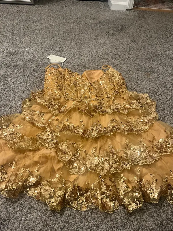 Stacees Shine in this elegant gold lace dress, perfect for any special occasion. The intricate lace detailing adds a touch of sophistication. - Image 7