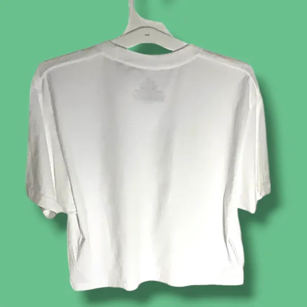 NWOT Monet Art Crop T Shirt White Graphic Tee The Beach Falaise d’Amont This NWOT Monet Art Crop T Shirt in white features a graphic design inspired by The Beach Falaise d’Amont 1889, making it a stylish and artistic addition to any woman's wardrobe. Made from 100% cotton, this regular fit tee has a crew neckline and a cropped style for a modern and trendy look. Perfect for art enthusiasts or those looking to add a unique touch to their outfit, this T-shirt is comfortable and versatile, ideal for everyday wear. - Image 3