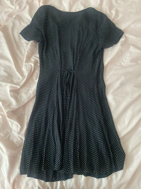 Black polka dot dress with ruffle neckline and short sleeves - Image 2