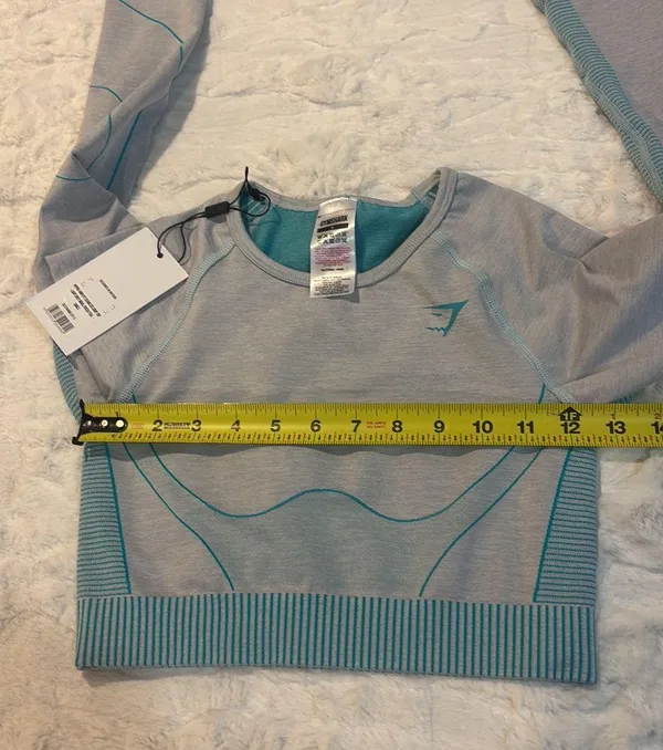 Gymshark Women's Teal and Gray Long Sleeve Crop Top Size Small . Stylish long sleeve crop top by Gymshark. Features a sleek teal and gray design. Perfect for workouts.. NWT - Image 7