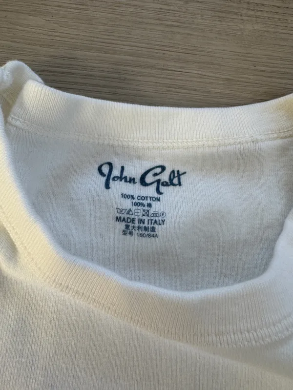 Brandy Melville White Tee with Black Star Patch - Image 2