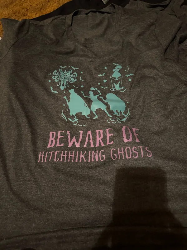 Gray t-shirt featuring a ghost print in teal and pink of the Hitchhiking Ghosts of the Haunted Mansion. Great for Disney parks and Halloween parties. - Image 4