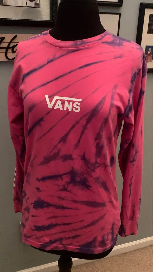This is a pink and purple Vans tie-dye long-sleeve t-shirt featuring the brand's signature white logo on the chest. - Image 6