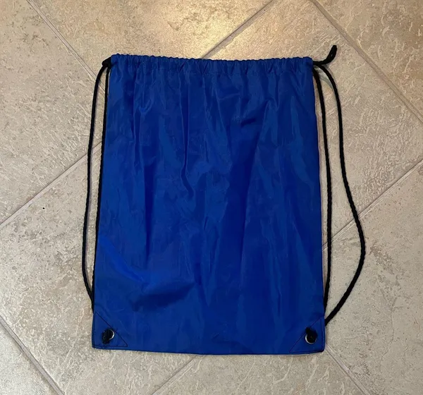 Blue drawstring bag. Measures 17 1/2 inches long x 13 inch wide - Image 2