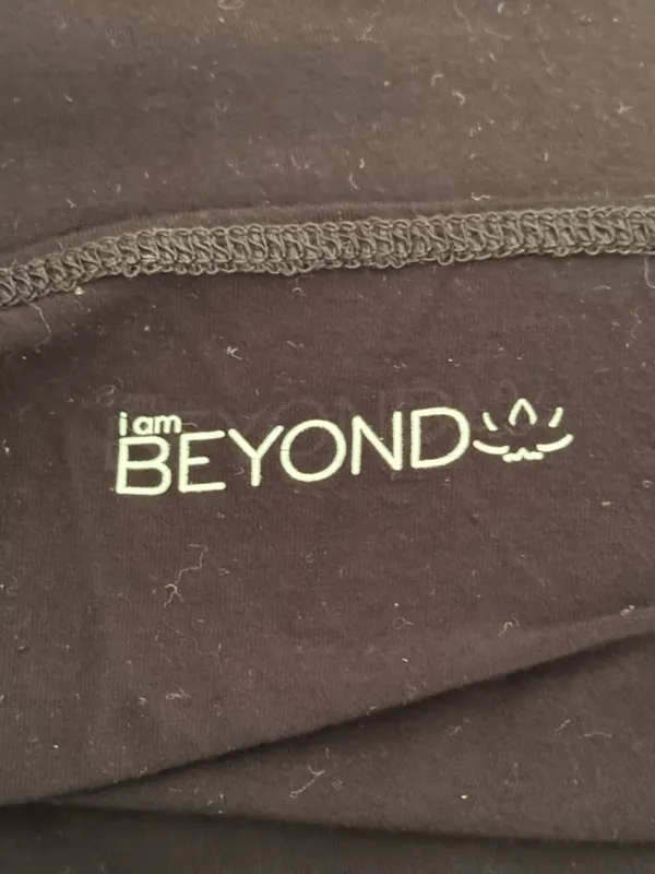 Beyond Yoga I am Beyond Black One Shoulder Bell Sleeve Tunic in Black - Image 4