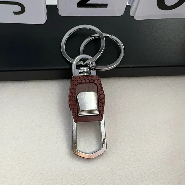 Practical carabiner keychain designed for both men and women for everyday carrying needs. Comes with double key rings, allowing you to classify and organize different keys separately. This keychain is 2.5 inches in length and 0.9 inches in width, compact and portable to carry around. Suitable for car keys, home keys, small gadgets, backpacks and handbags for convenient hanging. Simple versatile style matches various scenarios, a nice daily accessory and casual small gift. - Image 4