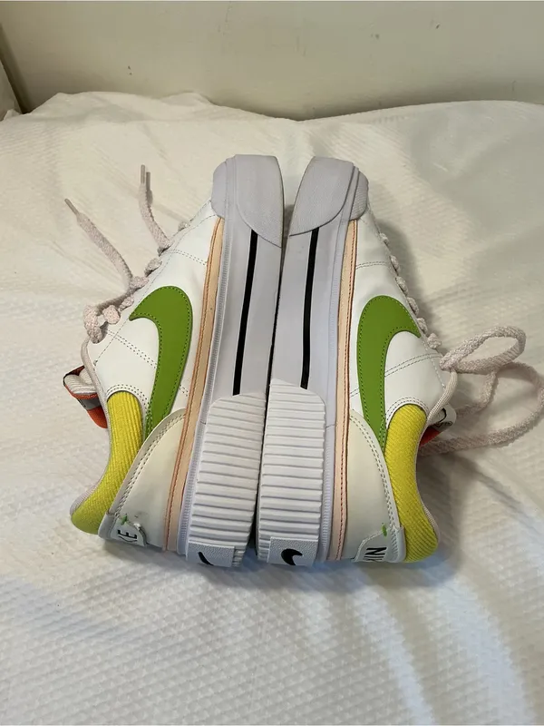 Nike White Low-Top Sneakers with Orange Tongue and Subtle Pink Lining - Image 6
