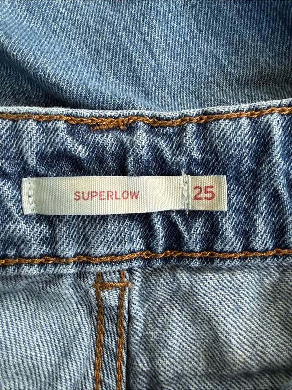Levi's light blue denim jeans with tan leather patch - Image 4