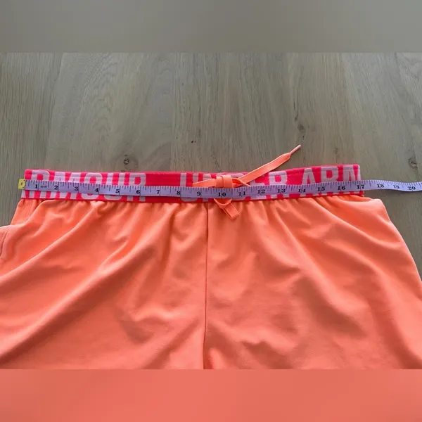 Under Armour women’s loose fit orange & pink athletic shorts large - Image 5