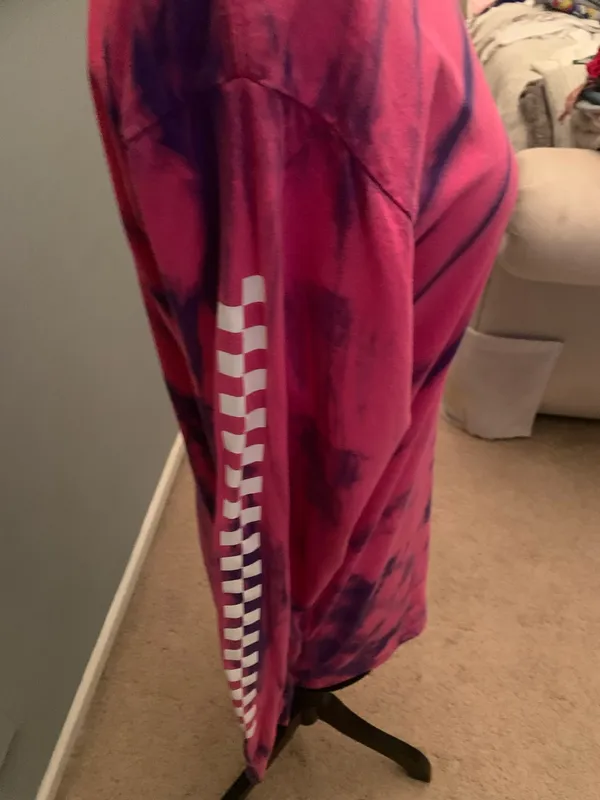 This is a pink and purple Vans tie-dye long-sleeve t-shirt featuring the brand's signature white logo on the chest. - Image 3