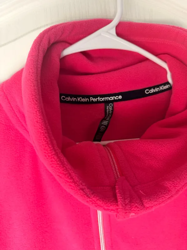 Calvin Klein fleece teddy jacket in vibrant hot pink. Full-zip front with stand collar. Side pockets for hands. Subtle branded detail on the sleeve. Soft, cozy finish for everyday wear. - Image 5
