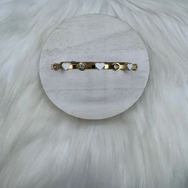 This chic bracelet showcases a beautiful gold finish with delicate white heart d - Image 5