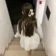 Emily E.