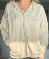 Beige Pacsun zip up hoodie with pockets and hood. Size M. Photo 0