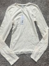 DAZE Cream Ribbed Long-Sleeve Crew Top with Lettuce Hem Photo 0