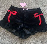Sugar Thrillz Black Velvet Ruffle Shorts with Red Bow Accents Photo 0