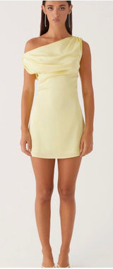 Sleek one-shoulder mini dress with draped neckline. Smooth, fitted silhouette for a modern look. Soft lemon yellow tone for a fresh, feminine vibe. Ideal for evening outings or special events. Photo 0