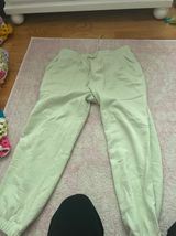 green sweatpants Photo 0