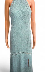 GUESS Sleeveless Mint Lace Halter Maxi Dress. Elegant mint lace halter maxi dress with delicate crochet trim. Soft mint color adds a fresh, feminine look. Halter neckline flatters the shoulders for a polished silhouette. Lightweight lace fabric offers breathable, comfortable wear. Ideal for weddings, garden parties, or special occasions. Photo 0