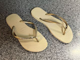 Havaianas Women’s Slim Flip Flops - Beige Footbed with Gold Straps Photo 0