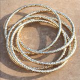 Gold Tone Interlocking Bangle Bracelets Photo 0