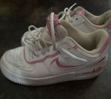 Pink and white Nikes Photo 0