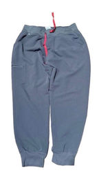 FIGS Zamora Jogger Scrub Pants Charcoal Grey Size Medium FIGS Zamora jogger scrub pants in charcoal grey, size Medium/Petite. Jogger cut with tapered leg and elastic ankle. Red drawstring waistband, zippered pocket. Technical Collection fabric, Threads for Threads edition. Pre-owned, no visible wear. Photo 0