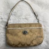 COACH Tan Signature Canvas Turnlock Wristlet Photo 0