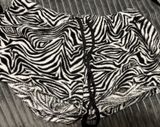 Super cute black & white zebra print fuzzy bottoms 🖤🤍 • Size 11–13 (UG) • Black & white zebra print • Soft/fuzzy material • Adjustable black drawstring waist • Y2K / coquette / edgy aesthetic Perfect with a cropped tank, baby tee, or oversized hoodie! Good used condition — see photos for details. Photo 0
