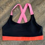 Wilo the Label sports bra featuring a vibrant black and coral Size‎ Large Photo 0