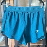 Gymshark Running Shorts athletic band teal green blue workout flowy stretchy low Photo 0