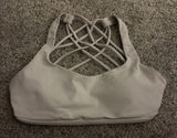 white lulu sports bra! barely worn, great condition! size 0! comes with pads! originally $48, selling for $25! ! Photo 0