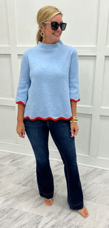 Blue sweater with scalloped red trim Photo 0