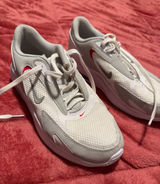 Nike Women's White and Light Gray Running Shoes with Red Swoosh Photo 0
