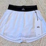 Alo Yoga white tennis skirt with black waistband size L Photo 0