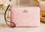 NEW Coach Corner Zip Wristlet In Powder Pink Signature Canvas With Charms NWT Photo 0