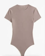 Abercrombie | Seamless Cotton-Blend Short Sleeve Thong Bodysuit in Tan Photo 0