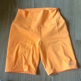 Alo Bright Orange Biker Shorts Photo 0