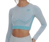 Gymshark Women's Teal and Gray Long Sleeve Crop Top Size Small . Stylish long sleeve crop top by Gymshark. Features a sleek teal and gray design. Perfect for workouts.. NWT Photo 0