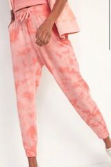 Stay stylish and comfortable with these pink tie-dye jogger pants Photo 0