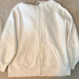 TNA White Zip Photo 0