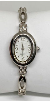 Silver tone women’s quartz analog watch 19mm oval white dial rhinestones running Photo 0