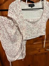 Windsor Set Lovesome white and pink floral two piece with tie detail on the top and bottom of the skirt. #floral #twopiece Photo 0