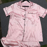 Pink Satin Pajama Set with Black Piping - Short Sleeve Top and Shorts Photo 0